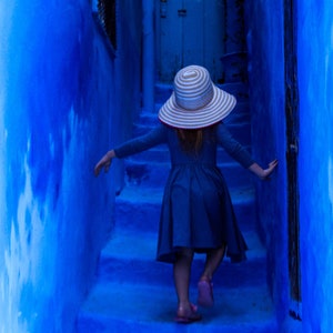 Girl in blue dress in the blue city. Chefchaouen Morocco, Photographic Print