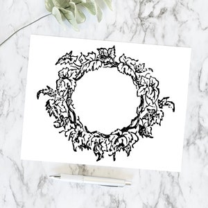 May include: A black and white illustration of a wreath made of leaves and vines. The wreath is circular and has a blank space in the center.