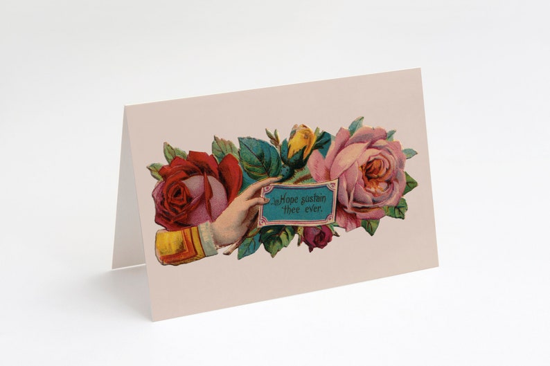 May include: A vintage card with a hand holding a blue sign that reads "In Hope sustain thee ever." The sign is surrounded by pink, red, and yellow roses with green leaves.