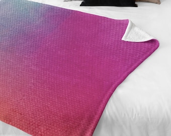 Manta rosa, naranja y azul