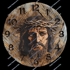 May include: A round wooden clock with a carved image of Jesus wearing a crown of thorns. The clock face features dark brown numerals and hands, set against a light brown, textured wood background. The clock is approximately 10 inches in diameter.