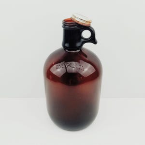 VTG 1Gal Jug with Finger Loop Handle/Lid. Rustic Vintage Amber Glass 1 Gallon Whiskey/Liquor Jug with Original Screw Top Lid and Handle.