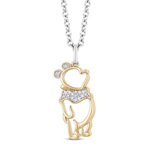 May include: A gold and silver necklace with a diamond-encrusted Winnie the Pooh pendant.