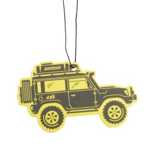 May include: Yellow car air freshener with a black silhouette of a 4x4 vehicle with a roof rack and the word "Overlander" on the roof. The car has the words "Diesel" and "4x4" on the side.