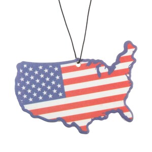 May include: A car air freshener shaped like the United States of America with a blue outline and a red, white, and blue American flag design.