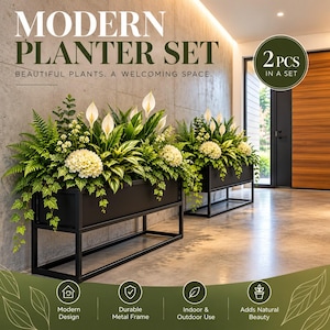 May include: A set of two rectangular black metal planters on elevated frames, each containing a variety of green foliage, white peace lilies, and white hydrangea flowers. The text reads MODERN PLANTER SET, 2 PCS IN A SET, and BEAUTIFUL PLANTS.