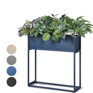 May include: A blue metal planter with a stand, filled with green and purple plants. The planter is rectangular and has a modern design.