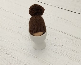 Walnut knitted egg cozies