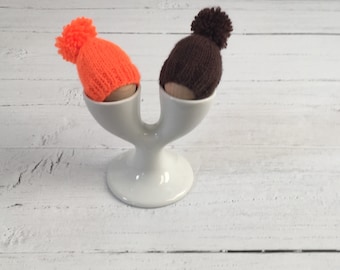 Knitted egg cosies, set of two in chocolate and orange