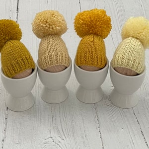 Set of four yellow knitted egg cosies, Easter gift, creme egg holders, stocking filler