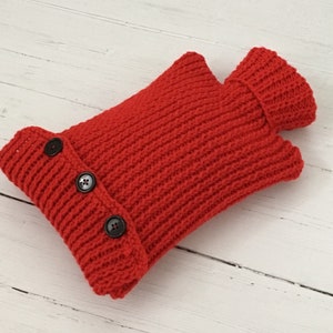 Red knitted hot water bottle cover