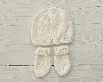 White hand knitted unisex baby hat and scratch mittens