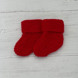 Red knitted baby booties for newborn, baby’s first Christmas