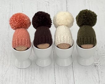 Set of four hand knitted egg cosies-neutral colours