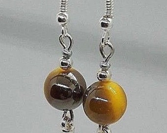 Boucles d’oreilles avec perles ton sur ton jaune foncé de Spike. Crochets en argent 925