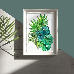 May include: A framed watercolor painting of tropical leaves in shades of green. The leaves are arranged in a cluster and have a detailed, intricate design.