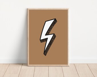 May include: A framed art print showing a white lightning bolt with a black outline and shading, set against a tan background. The artwork is in a light-coloured wooden frame, suitable for wall decor.