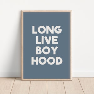 May include: A blue framed poster with white text that reads "LONG LIVE BOYHOOD".