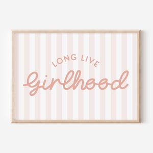 May include: Pink and white striped background with the text "Long Live Girlhood" in pink cursive lettering.