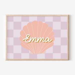 May include: A pink seashell with a white outline and the name "Emma" written in a gold script font on a purple and white chequered background.