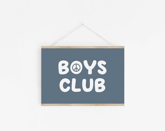 May include: A blue framed print with white text that reads "BOYS CLUB" with a peace sign symbol in the "O".