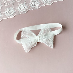 Baptism headband with a bow for baby girl