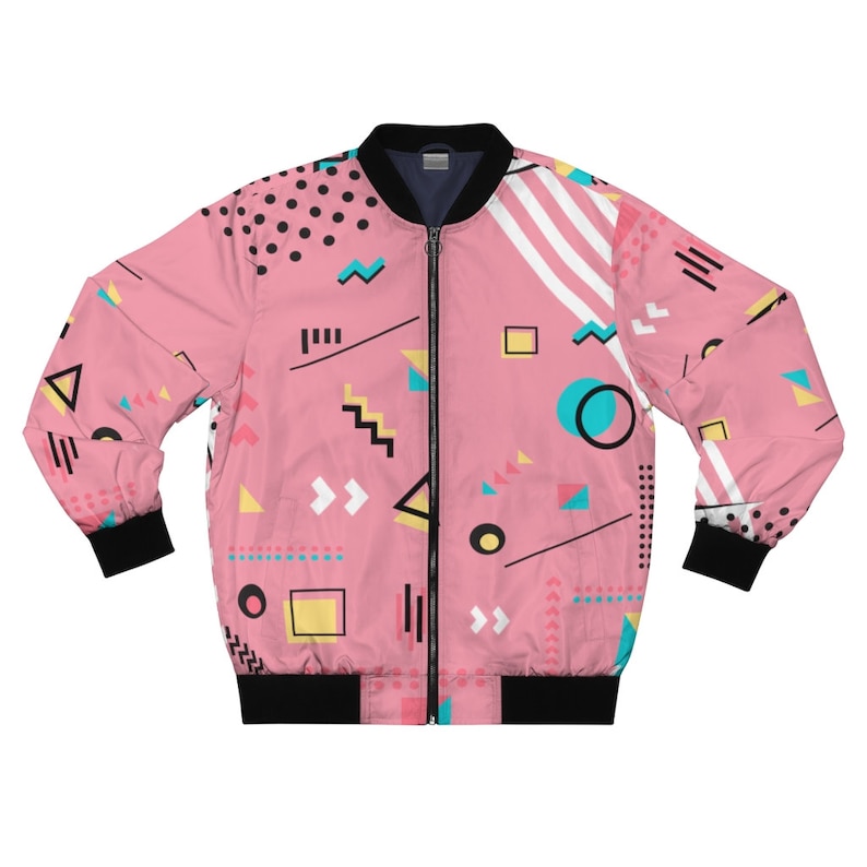May include: A pink bomber jacket with a geometric pattern in black, white, yellow, blue, and turquoise. The jacket has a zipper closure and ribbed cuffs and waistband.
