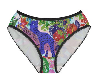 May include: Black and white lace trim underwear with a colourful tropical print featuring a blue leopard and various flowers and plants.