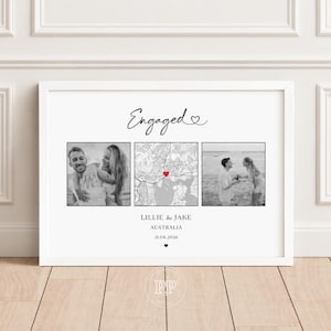 May include: A framed horizontal print featuring the word Engaged in script with a heart, two black and white photographs of a couple, and a central map with a red heart marker. Below are the names Lillie & Jake, Australia, and the date 21.08.2026.