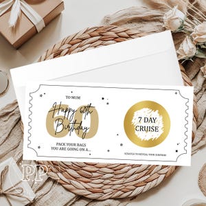 May include: A white birthday card with a black border and gold accents. The card reads "Happy 60th Birthday" and "7 Day Cruise". The card is on a woven mat with a white envelope and a gift box in the background.