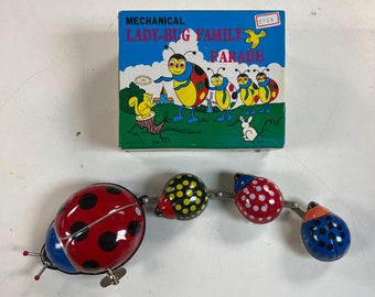 Vintage Mechanical Lady-bug Family Parade Wind-up Toy