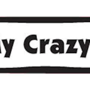 May include: White bone-shaped sticker with a black outline. The sticker says "I love my crazy dog" with a red heart in place of the "o" in "love".