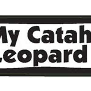 May include: White bone-shaped sticker with a black outline. The sticker says "I love My Catahoula Leopard Dog" with a red heart in place of the "o" in "love".