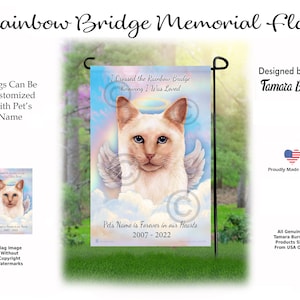 May include: A white Siamese cat with blue eyes and angel wings is depicted on a garden flag. The flag has a rainbow bridge and clouds with the text "I Crossed the Rainbow Bridge Knowing I Was Loved". The flag also includes the text "Pet's Name is Forever in our Hearts 2007 - 2022".