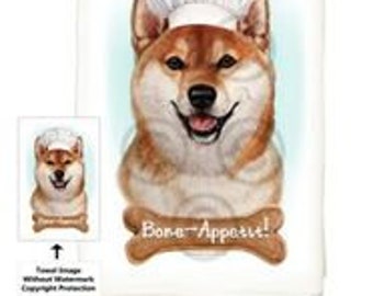 Puede incluir: Una toalla de cocina con un perro Shiba Inu que lleva un gorro de chef blanco. El perro sonríe y tiene un cartel en forma de hueso que dice "Bone Appetit!" debajo.