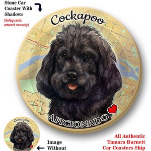 May include: Round absorbent stone car coaster featuring a detailed portrait of a black Cockapoo dog. The coaster has the word "Cockapoo" above the dog's head and "Aficionado" below. A red heart is also included.