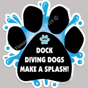 May include: A blue and black paw print with water splashes around it. The paw print has the text "DOCK DIVING DOGS MAKE A SPLASH!" inside. The text "Tamara Burnett, 2019 ©" is on the top right corner of the image.