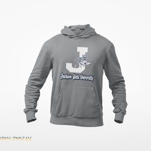 May include: A gray hooded sweatshirt with a white letter J and a white tiger graphic. The text "Jackson State University" is printed in navy blue below the graphic.