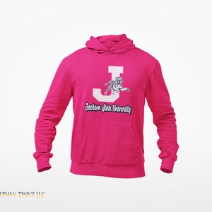 May include: A pink hoodie with a white letter J and a tiger graphic. The text "Jackson State University" is printed below the graphic.