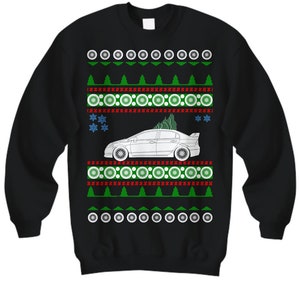 May include: Black Christmas sweater with a white car and green trees. The sweater has a repeating pattern of white circles, green trees, and red and white stripes.