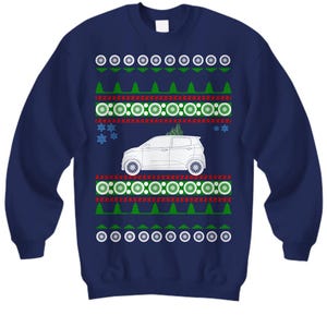 May include: Navy blue sweatshirt with a festive design. The design includes a white car, green Christmas trees, snowflakes, and a pattern of white circles and red and green rectangles. A fun, holiday-themed sweater.