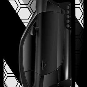 May include: Black sports car with yellow brake calipers, set against a black and white geometric background. The car has a sleek design with visible details like the wheels and side panels. The image includes the "TOOL and DYE designs" logo.