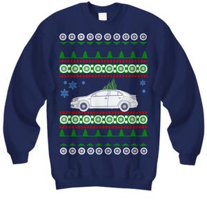 May include: Navy blue sweatshirt with a festive design. The design includes a white car with a Christmas tree on top, surrounded by green trees, snowflakes, and white and green circular patterns. A fun holiday sweater.