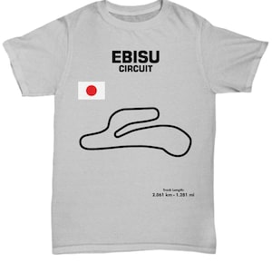 May include: A gray t-shirt with a black and white illustration of the Ebisu Circuit racetrack. The t-shirt also features a Japanese flag and the text "Ebisu Circuit". The track length is listed as 2.061 km - 1.281 mi.