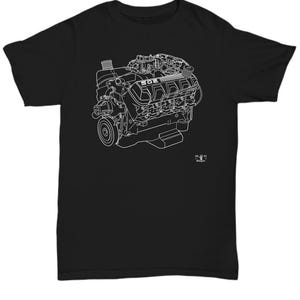 May include: Black t-shirt with a white outline of a 502 engine. The engine is a cutaway view showing the internal components. The text "The Big 502" is printed on the bottom of the shirt.