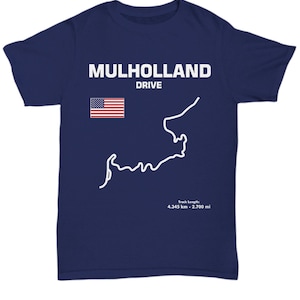 May include: A navy blue t-shirt with a white graphic of the Mulholland Drive road course and the text "Mulholland Drive". The graphic also includes a small American flag. The text "Track Length: 4.345 km - 2.700 mi" is printed below the graphic.