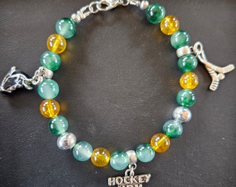 Pulseras con dijes de espíritu de equipo