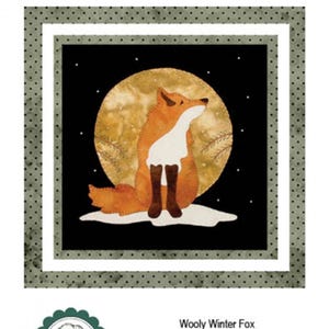 May include: A digital pattern for a wool applique quilt block featuring a red fox sitting in a snowy landscape under a full moon. The block is 8 inches square and is titled "Wooly Winter Fox".