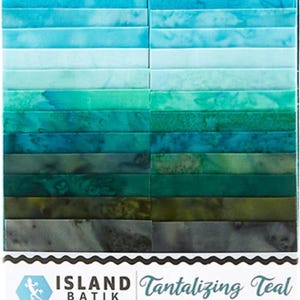 May include: A collection of teal batik fabric strips in varying shades of blue and green. The fabric is arranged in a vertical stack, with the brand name "Island Batik" and the collection name "Tantalizing Teal" visible on the packaging. Each strip is 2 1/2 inches wide.