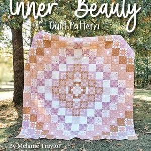 May include: A large, square quilt with a geometric pattern in shades of pink, white, and brown. The quilt is displayed outdoors with the text "Inner Beauty Quilt Pattern" and the dimensions 90" x 90".
